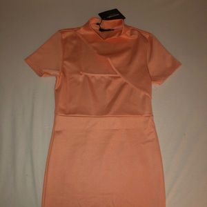 Beautiful mini dress with a cut on the top. Size large. Brand new.